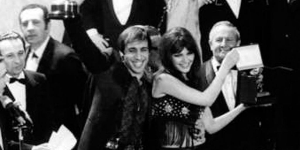 . Adriano Celentano and his wife Claudia Mori win the 1970 Sanremo Music Festival with Chi non lavora non fa l?amore . 28 February 1970. Olycom Press Agency 79 Sanremo 1970 Adriano Celentano Claudia Mori